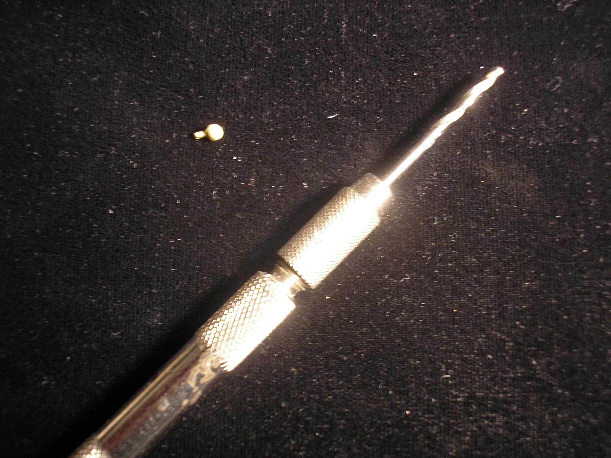 Headlight with .078&quot; Diameter drill and pin vise.