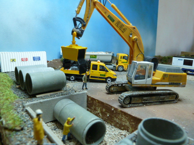 Liebherr 954 pose de tuyaux canalisation
